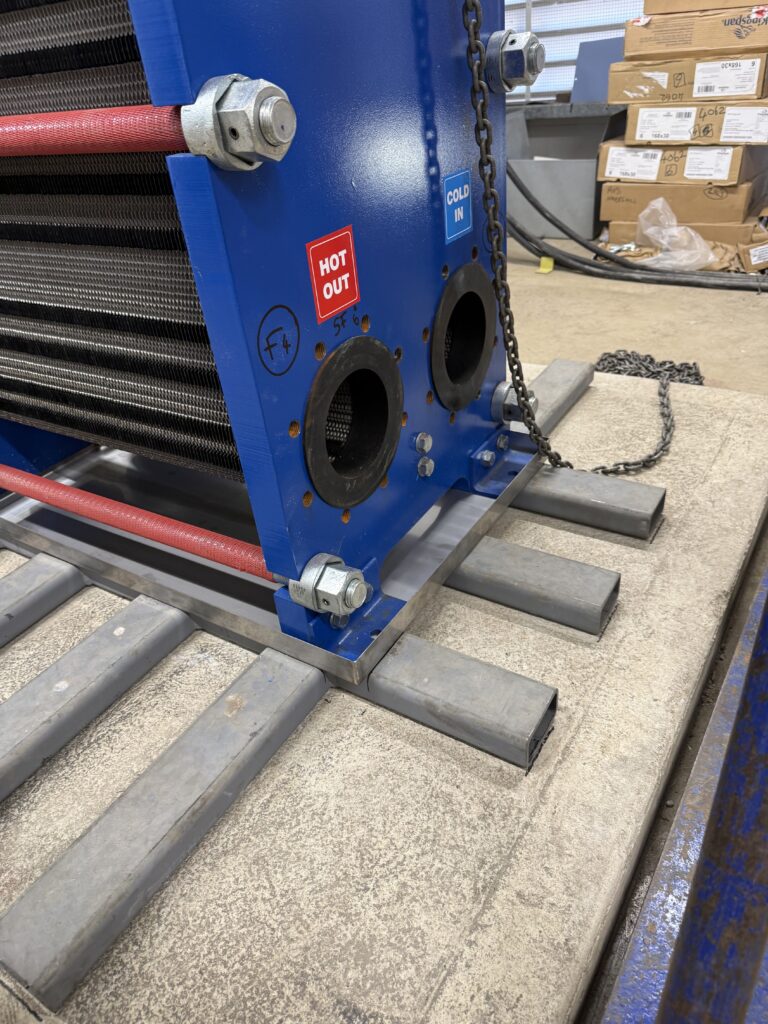 Close-up of heat exchanger top and chain lifting component